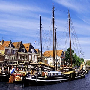 Netherlands, Hoorn, Old wooden sailboats moored along the banks