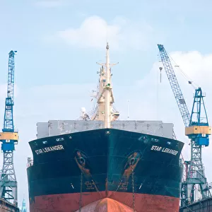 Ship in dry dock at Hamburg, Germany. ship, vessel, repair, dry dock, crane