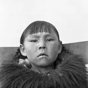 ALASKA: ESKIMO GIRL. Eskimo girl dressed in traditional clothing, Alaska. Photograph