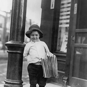 HINE: NEWSBOY, 1910. Six-year-old newsboy in St. Louis, Missouri. Photographed by Lewis Hine