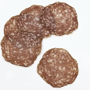 Five slices of Milanese salami