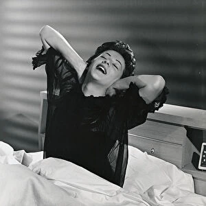 Woman waking up from her bed
