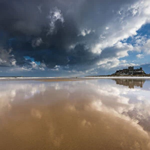 Bamburgh castle and beach reflections