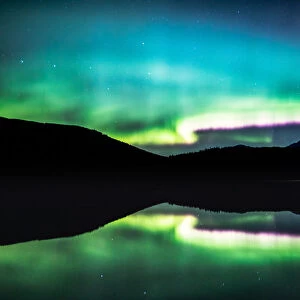 Northern lights reflection in a lake, Jasper, Canada
