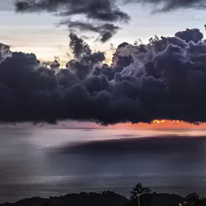 Dramatic sunset with storm clouds over Roseau, Caribbean sea view in Dominica, Lesser Antiles. September 2019