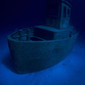 Wreck of tugboat Blue Plunder at night off Nassau, Bahamas