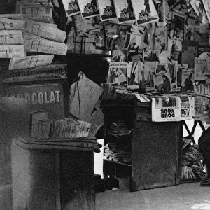 Newspaper stand, Paris, 1931. Artist: Ernest Flammarion