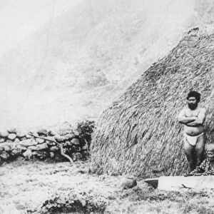 An old woman beating tapa in front of a pili grass house, Kalaupapa, Hawaii, 19th century