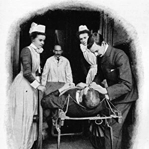 Receiving an accident case at Poplar Hospital, London, c1903 (1903)