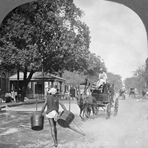 Watering the streets of Rangoon, Burma, 1908. Artist: Stereo Travel Co