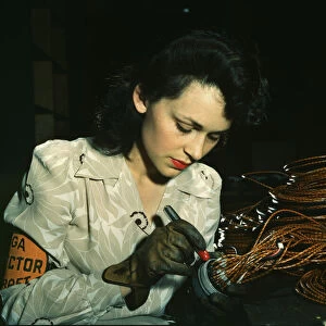 Woman aircraft worker, Vega Aircraft Corporation, Burbank, Calif. 1942. Creator: David Bransby