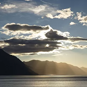 Sun shining behind clouds above Turnagain Arm, outside Anchorage, Alaska, United States
