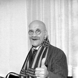 Actor Warren Mitchell in Australia tries to decide which team he favours for the FA Cup