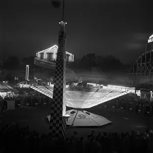 Battersea Park Fun Fair showing the Big Dipper at night during the Festival of Britain