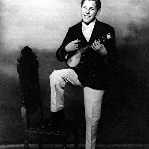 Bruce Forsyth as a teenager playing a ukulele circa 1945