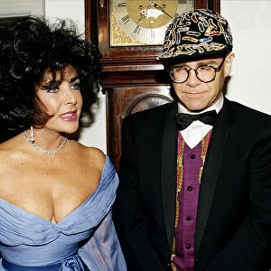 Elizabeth Taylor and Elton John together at a charity function for AIDS at Lodons