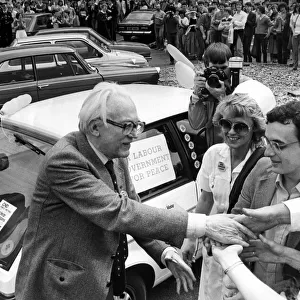 Michael Foot shaking hands with supporters during the walkabout