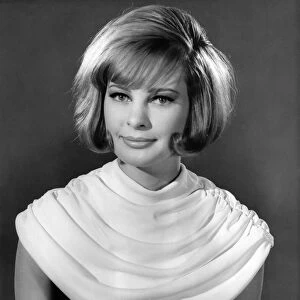 Model wearing a white neck scarf January 1963 P007634