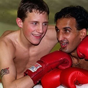 Tanveer Ahmed Glasgow lightweight Boxer with his arms round sparring partner Scott Dixon