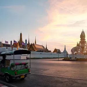 Tuk-tuk for passenger cars To go sightseeing around the Grand Palace in Bangkok with sunset sky background