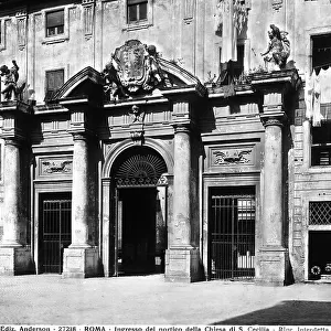 Monumental entrance that leads to the courtyard preceding the Basilica of S. Cecilia in Trastevere, Rome