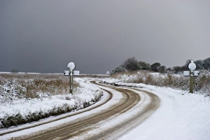 A149 coast road covered in snow at Cley NWT Reserve Cley Norfolk December A149 coast road covered in snow at Cley NWT Reserve Cley Norfolk December