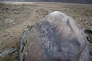Altai Prints: Ancient Petroglyphs in the high Altai near Bayan-Ulgii in western Mongolia perhaps
