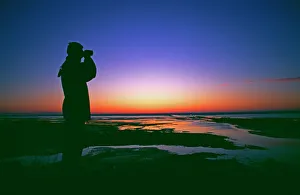 Birdwatching at dawn, Snettisham RSPB Reserve, Norfolk, UK