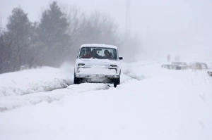 Car travelling along snow covered road during blizzard on route to Kazbegi Great Car travelling along snow covered road during blizzard on route to Kazbegi Great