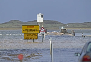 Causeway to Holy Island, covered at high tide. Lindisfarne, Northumberland, UK, summer Causeway to Holy Island, covered at high tide. Lindisfarne, Northumberland, UK, summer