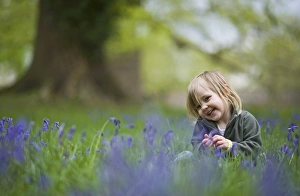 Children playing among Bluebells Norfolk May