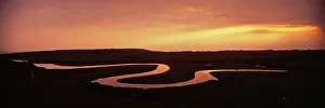 Cuckmere River, showing oxbow lakes at dusk, Cuckmere Haven, Sussex, summer Cuckmere River, showing oxbow lakes at dusk, Cuckmere Haven, Sussex, summer