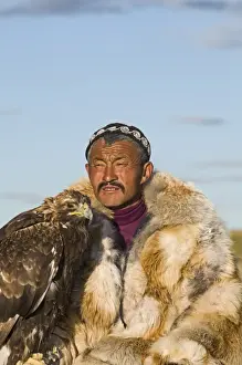 Altai Prints: Dalai Han an Kazakh eagle hunter with his Golden Eagle Bayan-Ulgii in Altai Mountains