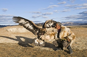 Dalai Han an Kazakh eagle hunter with his Golden Eagle Uglii in Altai Mountains western Dalai Han an Kazakh eagle hunter with his Golden Eagle Uglii in Altai Mountains western