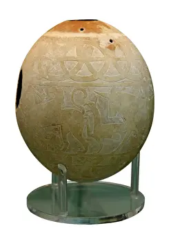 Ostrich Prints: Decorated Ostrich egg dating to around 600 BC used as water container and fou decorated