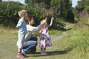 Family out on heath exploring nature Norfolk summer