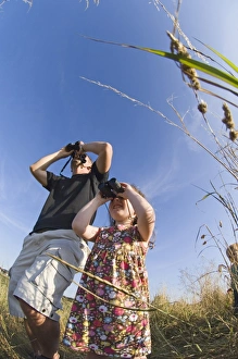 Father and daughter birdwatching at Cley North Norfolk August Father and daughter birdwatching at Cley North Norfolk August