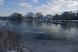 Frozen River Yare at Ferry Lane Wood near Postwick Norfolk December