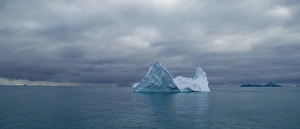 Iceberg on the south west side of South Georgia with Annekov Island in background Iceberg on the south west side of South Georgia with Annekov Island in background