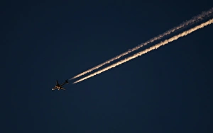 Global Warming Prints: Jet airliner over Norfolk at dusk