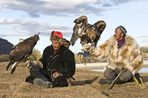 Kazakh eagle hunters with their Golden Eagles Bayan-Ulgii in Altai Mountains western Kazakh eagle hunters with their Golden Eagles Bayan-Ulgii in Altai Mountains western