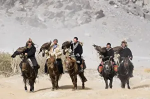 People Prints: Kazakh eagle hunters with Golden Eagles on way to the Eagle Hunters Festival in