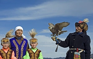 Kazakh hunter with Saker Falcon at Eagle hunters festival near Ulgii in western Mongolia Kazakh hunter with Saker Falcon at Eagle hunters festival near Ulgii in western Mongolia