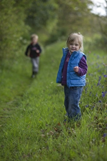 Kids playing along footpath in Norfolk countryside May Kids playing along footpath in Norfolk countryside May