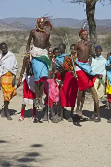Kenya Prints: Masai warrior jump dance being performed for tourists Samburu Kenya