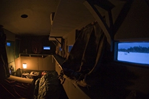 Midnight in bear photography hide with Wildlife photographer Jari Peltomaki sleeping Midnight in bear photography hide with Wildlife photographer Jari Peltomaki sleeping