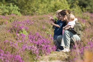 Mother and kids on heath in summer Norfolk UK