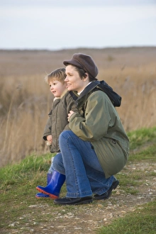 mother and son on bird reserve at Cley Norfolk winter