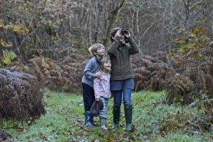 Autumn Prints: Mother, son and daughter on woodland walk in autumn Norfolk
