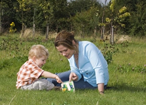 Images Dated 30th August 2006: Mother and toddler exploring nature Kent UK summer